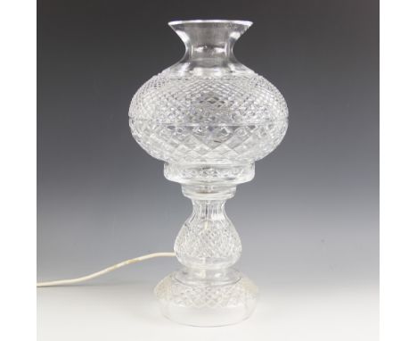 A Waterford Crystal table lamp, 20th century, modelled as an oil lamp with hobnail decoration, etched maker's mark, 47cm high