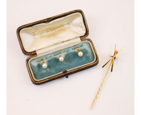 A cased set of pearl set dress studs, the button shaped cultured pearls mounted upon a yellow metal stud, marked 15ct, within