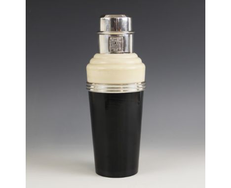 An Art Deco Incolour "The Master" cocktail shaker, early 20th century, the Bakelite body coloured ebony and ivory divided by 