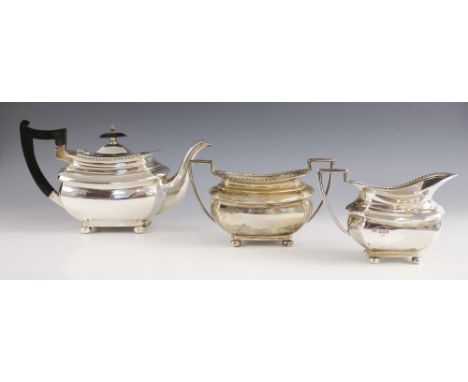 A George V silver tea service, Walker and Hall, Sheffield 1924-1927, comprising teapot, milk jug and sugar bowl, the gadroon 