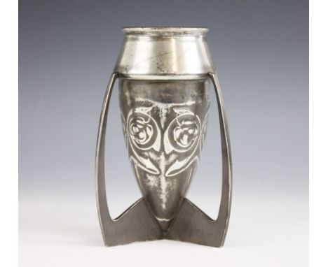 An Archibald Knox for Liberty and Co tudric pewter vase, the 'rocket' shaped vase with Art Nouveau floral decoration, stamped