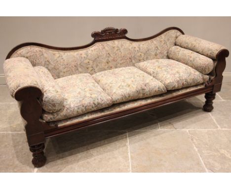 A William IV carved mahogany framed sofa, the shaped back centred with a 'C' scroll crest extending to padded scrolled arms u
