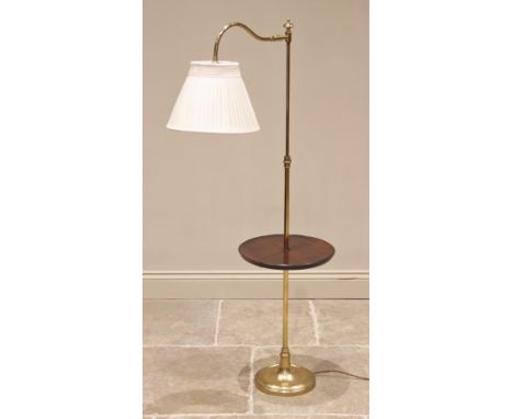 A lacquered brass floor standing reading lamp/table, late 20th century, the adjustable arm upon an extendable column with mah