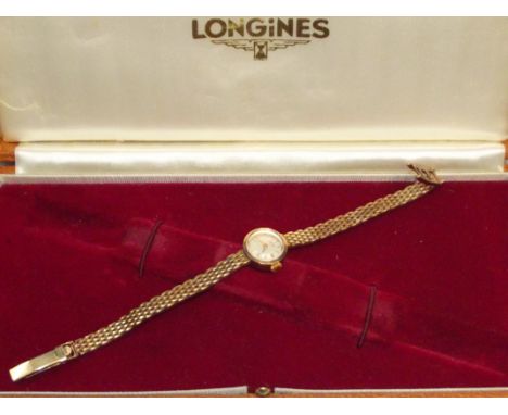 Longines ladies wristwatch  with 9ct yellow gold case and strap. Approx 19 grams, With original box. Manual wind, currently t