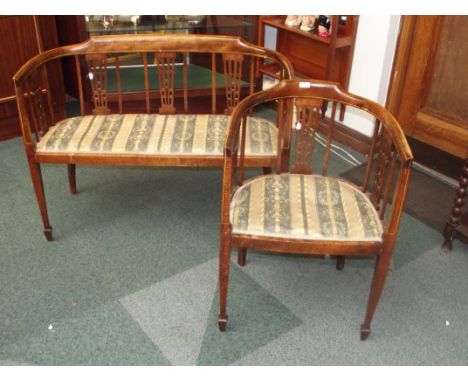 Edwardian part drawing room suite comprising tub chair and two seater sofa, tapering supports and spade feet