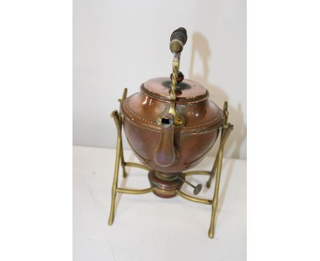 A vintage copper kettle &amp; burner on a brass stand 