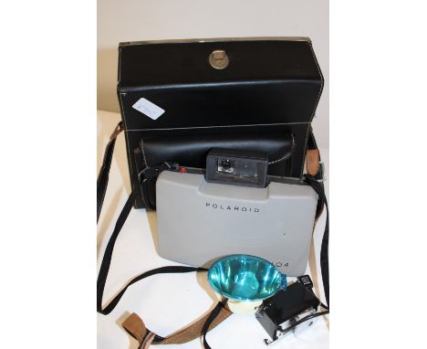 A Polaroid 104 camera and good quality case 