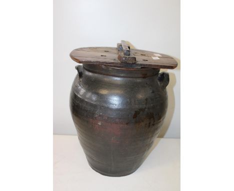 A antique ceramic urn with wooden cover h42cm 