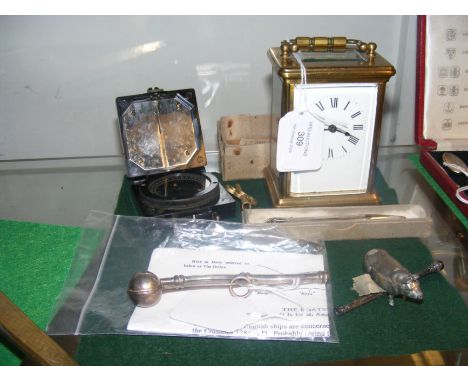 A Second World War Military compass, a carriage clock, bosuns whistle and other small collectables