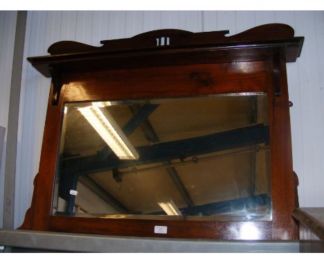 A mahogany overmantel mirror with top shelf 