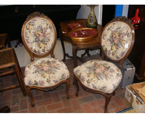 A pair of antique French button back side chairs