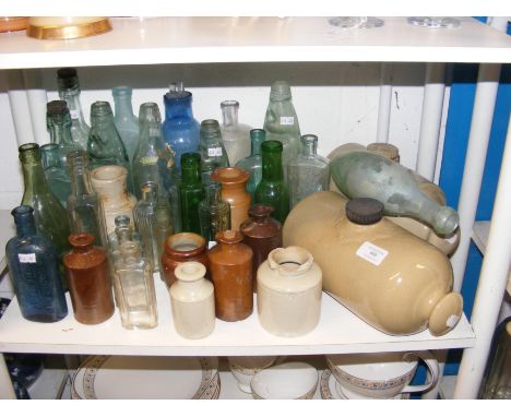 Antique glass and ceramic bottles, including Codd bottles 