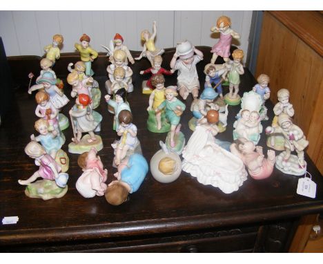 A collection of Royal Worcester figurines of babies and children 