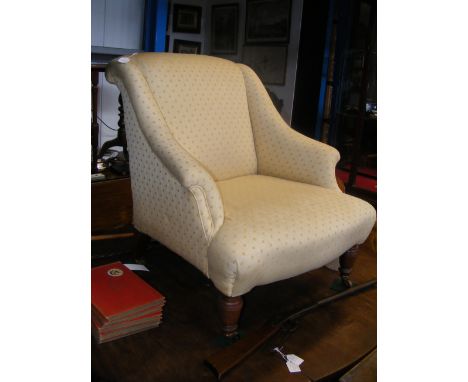 A Hampton & Sons of Pall Mall 19th century scroll armed easy chair on turned supports, the brass and ceramic castor stamped w