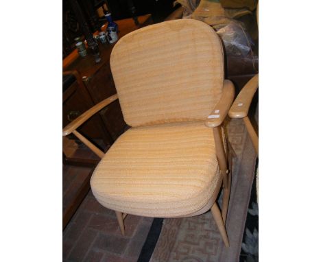 A vintage Ercol stick back easy armchair 