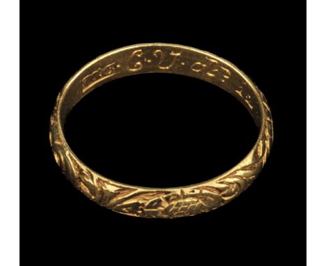 Memento Mori Ring. A George II yellow metal ring finely decorated with a skull, shells and foliate scrolls, the inner band wi