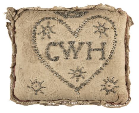 Pincushions. A layette pinwork trapunto pincushion, 1799, hand-stitched rectangular light beige quilted pincushion, front wit