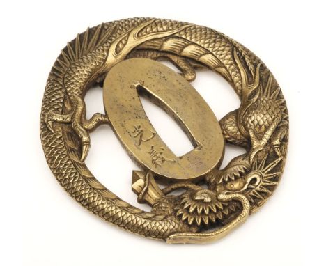 Tsuba. A fine Japanese bronze tsuba, 18/19th century, the oval sword guard formed as a dragon, with a two-character signature
