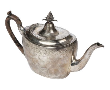 Teapot. An Irish silver teapot by Gustavus Byrne, Dublin 1775, of classical form with pineapple finial and foliate engraved d