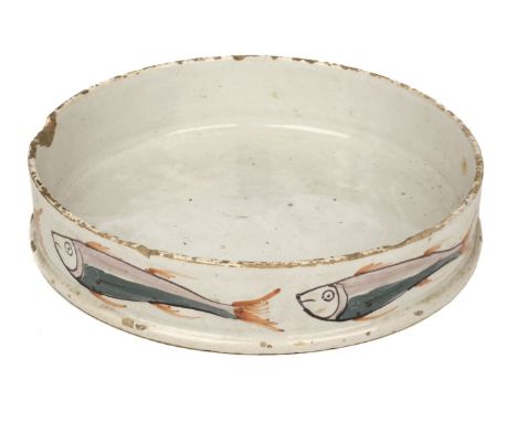 Liverpool Delft. An 18th century Liverpool Delft char-pot circa 1750, painted with fish in manganese, green and iron-red, old