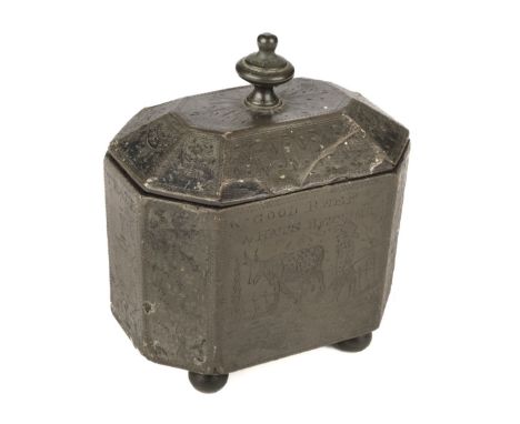 Tobacco Box. A George III period 'Folk Art' pewter tobacco box circa 1820, the canted cover with turned finial, the base engr