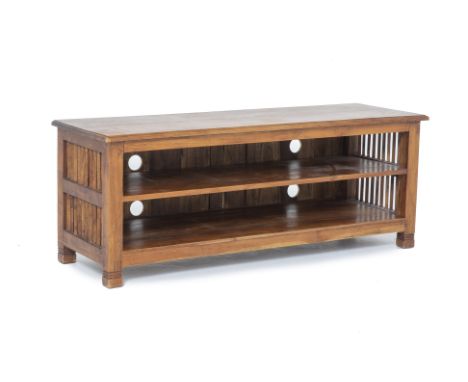 A TEAK TV CONSOLE
With pierced slatted sides and two shelves beneath, the back with four circular holes for wires
46cm x 120c