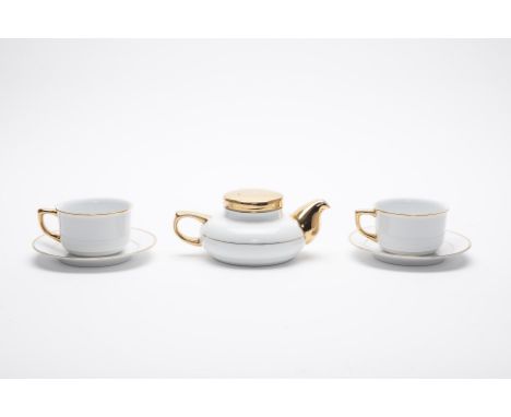 A GOLD PLATED PORCELAIN NORITAKE TEA SET
Comprising of a teapot and two cups and saucers, plated in 22k gold
Saucer 15cm diam