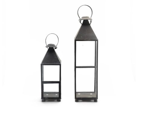 A PAIR OF GRADUATED STORM LANTERNS
Two sizes, with looped handles and glass walls
Larger item 80cm high
Condition: For a cond