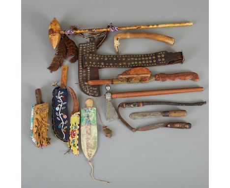 Group of twelve Native American weapons and tools, including one modern iron tomahawk; one Ojibwe trade knife, circa late 19t