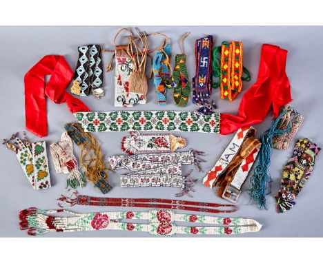 Group of sixteen beaded items, including eight sashes, two belts, five necklaces, and one button fob. Circa early to mid 20th