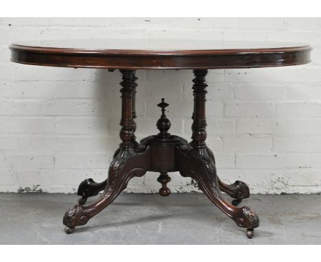 Victorian mahogany loo table, re-finished oval top on four column supports, carved and splayed legs, 85cm x 115cm.