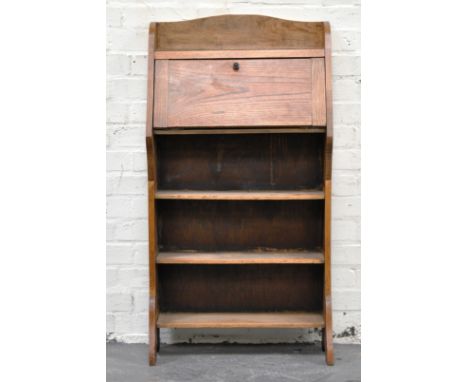 Edwardian light oak bureau, fall front enclosing a part fitted interior, three shelves under, width 57cm.