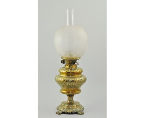 Brass oil lamp, embossed decoration with a Secessionist style frosted glass shade, complete with chimney, 58cm. SHADE BROKEN 