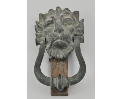 Cast brass lion mask door knocker, 24cm overall.