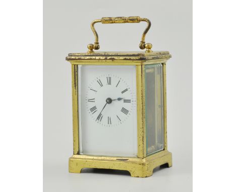 French lacquered brass carriage clock, white enamel dial, platform escapement, 12cm in a morocco carry case.