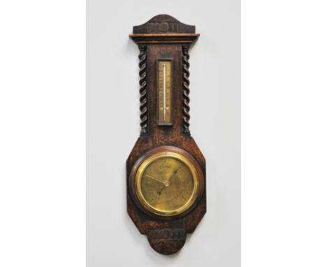 Oak cased aneroid wall barometer, brass dial with thermometer over, 69cm.