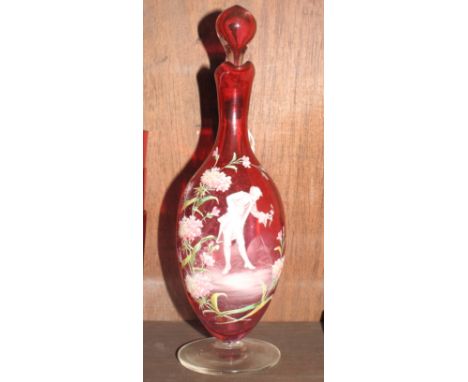 A 19th Century ruby glass decanter jug and stopper with "Mary Gregory" decoration of flowers and figure, 10" high