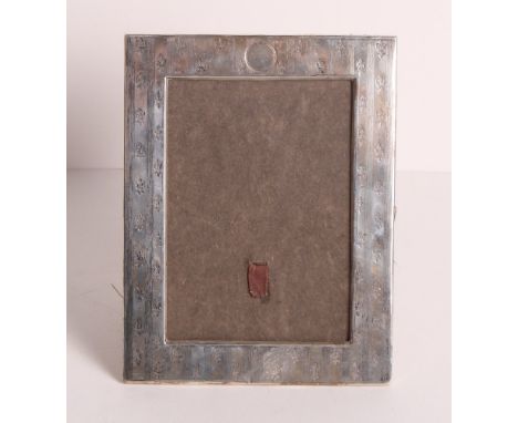 A silver rectangular photograph frame with engine turned and fleur-de-lis decoration