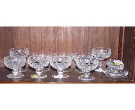 A set of seven Waterford diamond cut pedestal fruit dishes, two similar taller dishes, a Waterford mantel clock and an ashtra