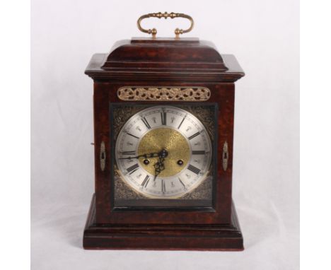 A Georgian design bracket clock with brass dial and silvered chapter ring, striking movement and burr walnut case