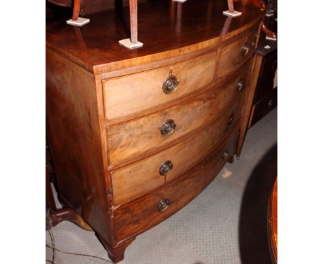 A 19th Century burr walnut bowfront chest of two short and three long drawers with circular brass handles, on ogee bracket su