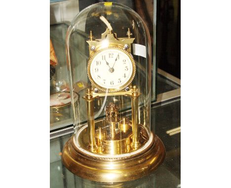 A brass 400-day clock under glass dome, 12" high