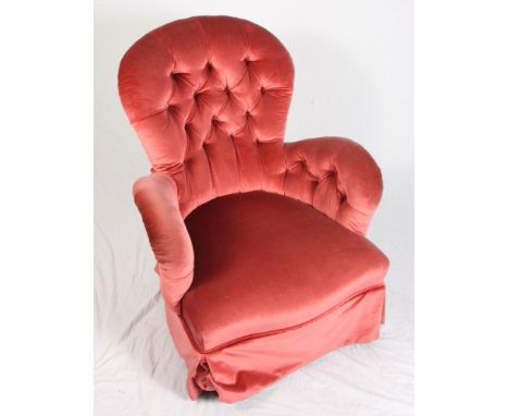A Victorian tub armchair, button upholstered in a pink velour