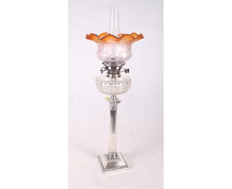 A Mappin & Webb oil lamp with cut glass reservoir, chimney and shade, on silver plated Corinthian column candlestick base (la