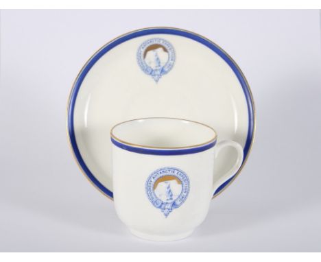 A Royal Doulton "Discovery Antarctic Expedition 1901" bone china coffee cup and saucer with blue and gilt rim and logo, colle