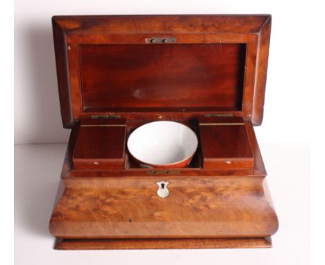 A figured mahogany bombe-shape two-division tea caddy, 14" wide