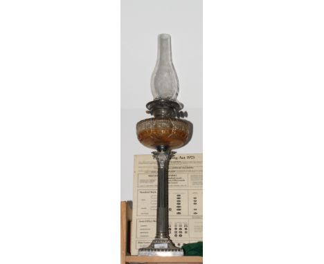 An early 20th Century oil lamp on silver plated Corinthian column
