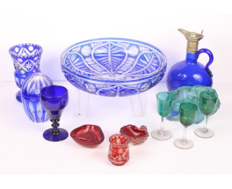 A Bohemian blue flashed crystal fruit bowl, a similar vase and jar, a blue glass flask with plated metal top and other colour