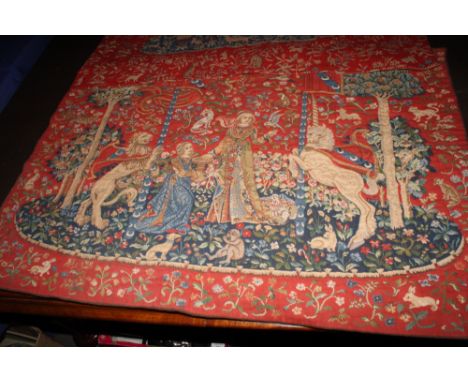 A Medieval design tapestry wall hanging showing two ladies, a lion and a unicorn, 36" x 26", a similar wall hanging and anoth