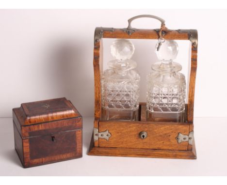 A George III mahogany rectangular tea caddy with hinged lid inlaid bone and ebony star design, 5" wide, and an oak framed two